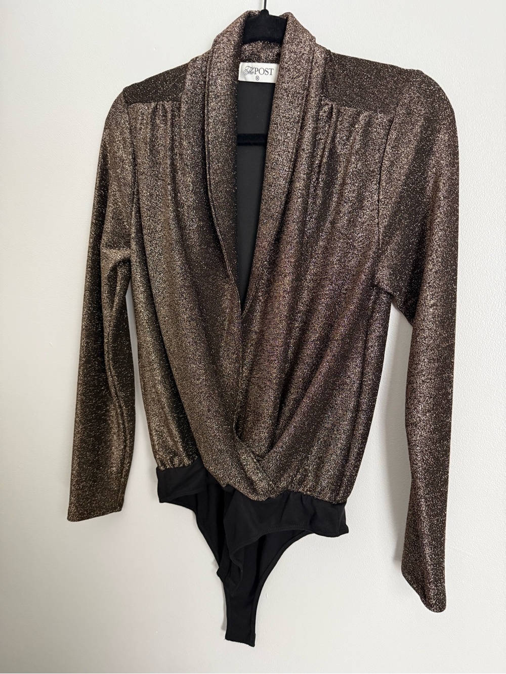 The Post Metallic Wrap-Front Bodysuit in Bronze and Black